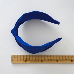 Classic royal blue knotted fabric headband with a wide design and a comfortable fit