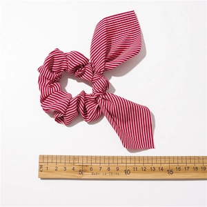 Striped bunny ear scrunchie in red and white with a 15cm diameter size measurement