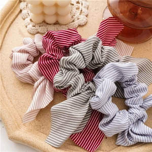 Striped bunny ear hair scrunchies with long bows in pink red blue and grey colors