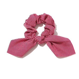Red and white striped scrunchie with rabbit ear bow design for women's hair styling
