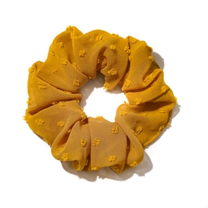 Ginger yellow seersucker scrunchie with flocking polka dots on white background