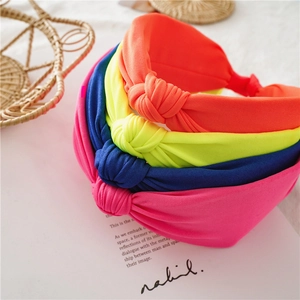 Neon knotted fabric headbands in orange yellow pink blue colors for women hair styling