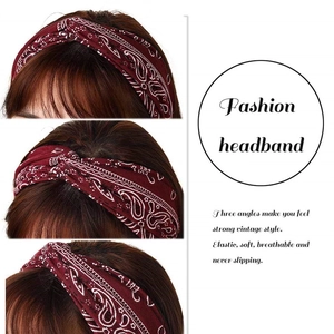 Detail of burgundy paisley knotted headband with elastic, soft, and breathable fabric