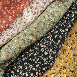 Detail of diverse floral patterns and soft woven texture on elastic headbands fabrics