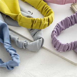 Macro shot of colorful pleated elastic headbands in soft pastel macaron shades