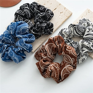 Vintage paisley pattern scrunchies in navy, black, brown and white colors