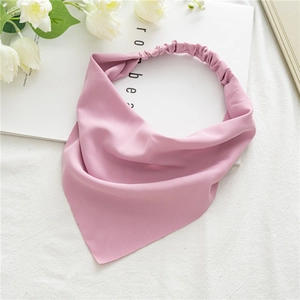 Detail of pink chiffon headscarf showing the elastic band and smooth fabric texture
