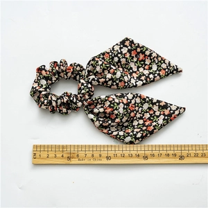 Floral print scrunchie with long ribbons and wooden ruler for size reference