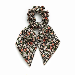 Floral print scrunchie with ribbons, elegant black fabric with white and orange flowers