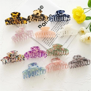 Set of 11 leopard and acetate hair claws in various patterns for stylish hair styling