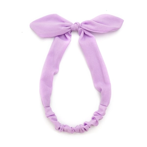 Pale purple neon fabric headband with a decorative bunny ear bow and elastic design