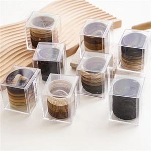 Set of 50 elastic seamless hair bands in Earth tones packed in a transparent box