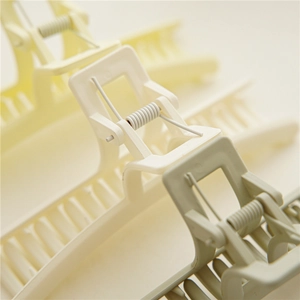 Detail of high-elastic metal spring and matte shark hair claw clip for thick hair