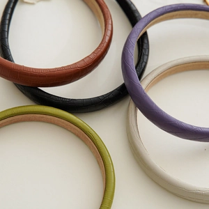 Detail of colorful snakeskin texture PU leather headbands with soft non-slip velvet lining