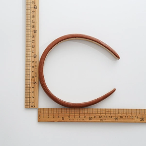 Brown snake skin texture PU leather headband with sponge padding showing size measurements