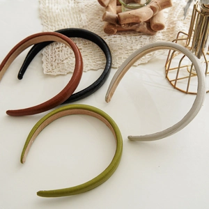 Detailed set of four faux crocodile leather padded headbands in multi-color textures