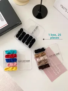 Detailed view of 25-piece high elastic hair tie set neatly packed in a clear storage box