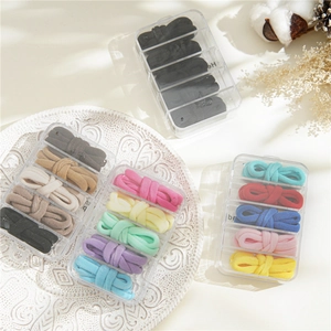 Close-up of high elasticity colorful hair ties in transparent five-grid storage boxes