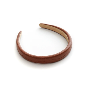 Brown faux leather headband with embossed crocodile pattern and non-slip inner lining
