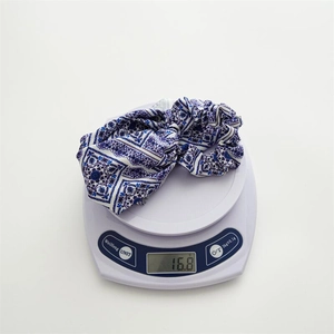 Blue and white checkered satin scrunchie with tail, weighing approximately 16.8 grams