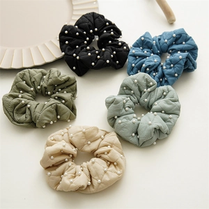 Detail view of 5-piece quilted fabric scrunchies set with faux pearl embellishments