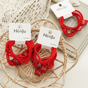 Three sets of red woven hair bands with gold festive embroidery and cute tiger pattern