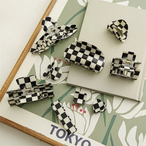 Classic black and white checkered hair claw set featuring various square and heart shapes