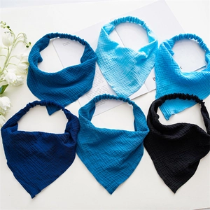 Set of six soft cotton muslin baby headbands with elastic bands in assorted blue shades