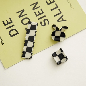 Three-piece black and white checkered hair claw set including square and rabbit ear shapes