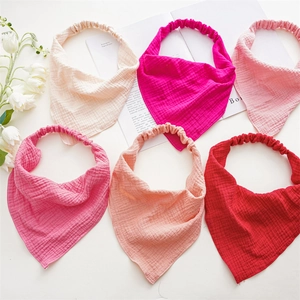 Set of 6 soft muslin cotton baby headbands in various colors with floral decor
