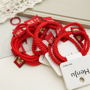 Elastic red hair ties set with Chinese New Year tiger embroidery and festive labels