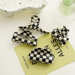 Classic black and white checkered hair claw clip set in four distinct geometric shapes