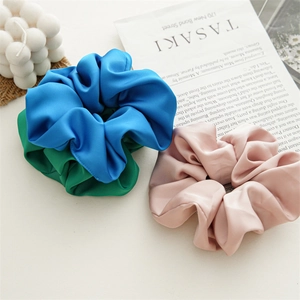 Three-piece satin scrunchie set in blue green and pink with elegant silk texture