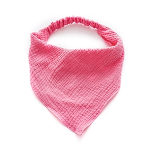 Pink gauze baby bandana bib with elastic strap and absorbent cotton muslin fabric