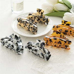 Square acrylic leopard print hair claws in assorted tortoise and spotted patterns