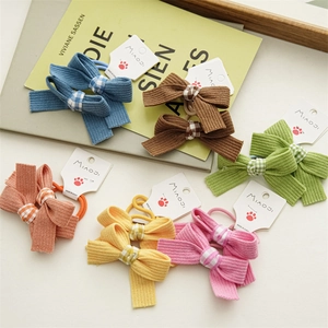 Detail of colorful ribbed bow hair ties for girls in six vibrant candy shades