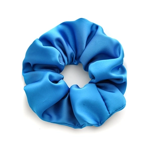 Vibrant royal blue satin scrunchie with glossy silk texture and pleated elastic hair band