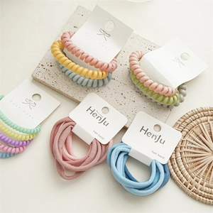 Set d'élastiques à cheveux spirale et chouchous en couleurs pastel de macaron