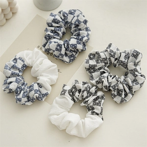 Set of four checkered and floral scrunchies with soft cotton fabric texture
