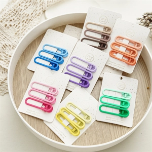 Set of matte colorful duckbill hair clips in various pastel shades for styling hair