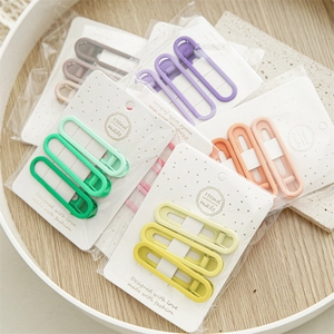 Close-up of matte Morandi candy colored hair clips set on elegant display cards