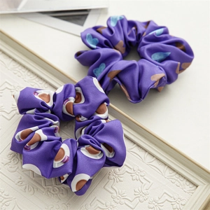 Deep purple satin scrunchie set with heart and coffee prints on textured background