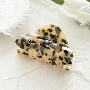 Close-up of square acrylic hair claw clip with classic leopard tortoiseshell pattern