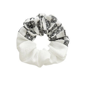 Spring black and white daisy pattern scrunchie with layered fabric and checkered design