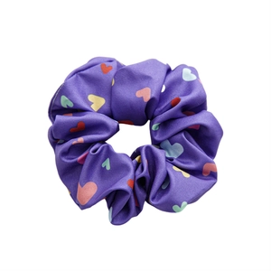 Periwinkle blue satin scrunchie with colorful heart pattern for hair styling