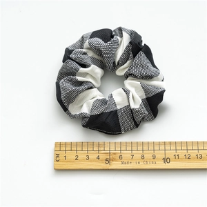 Classic black and white checkered oversized scrunchie with fine fabric texture, 9cm size