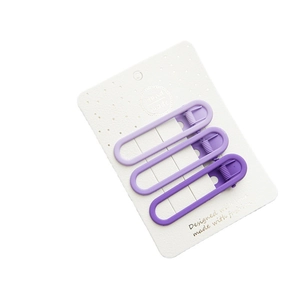 Set of 3 matte purple gradient hair clips in oval hollow design on white card