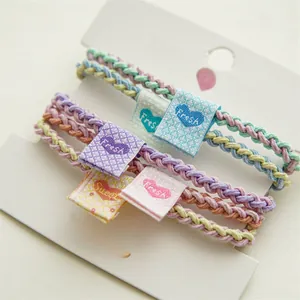 Set of 5 colorful woven elastic hair bands with Fresh and Sweet fabric labels