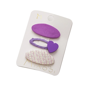 3-piece kids hair clip set with purple hearts and fabric textures on display card