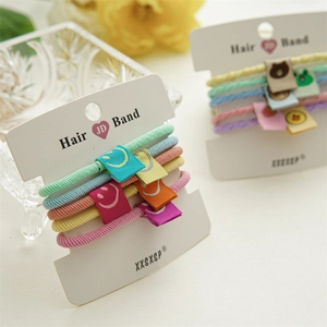 Detailed macro view of colorful elastic hair bands with cute cartoon fabric patches